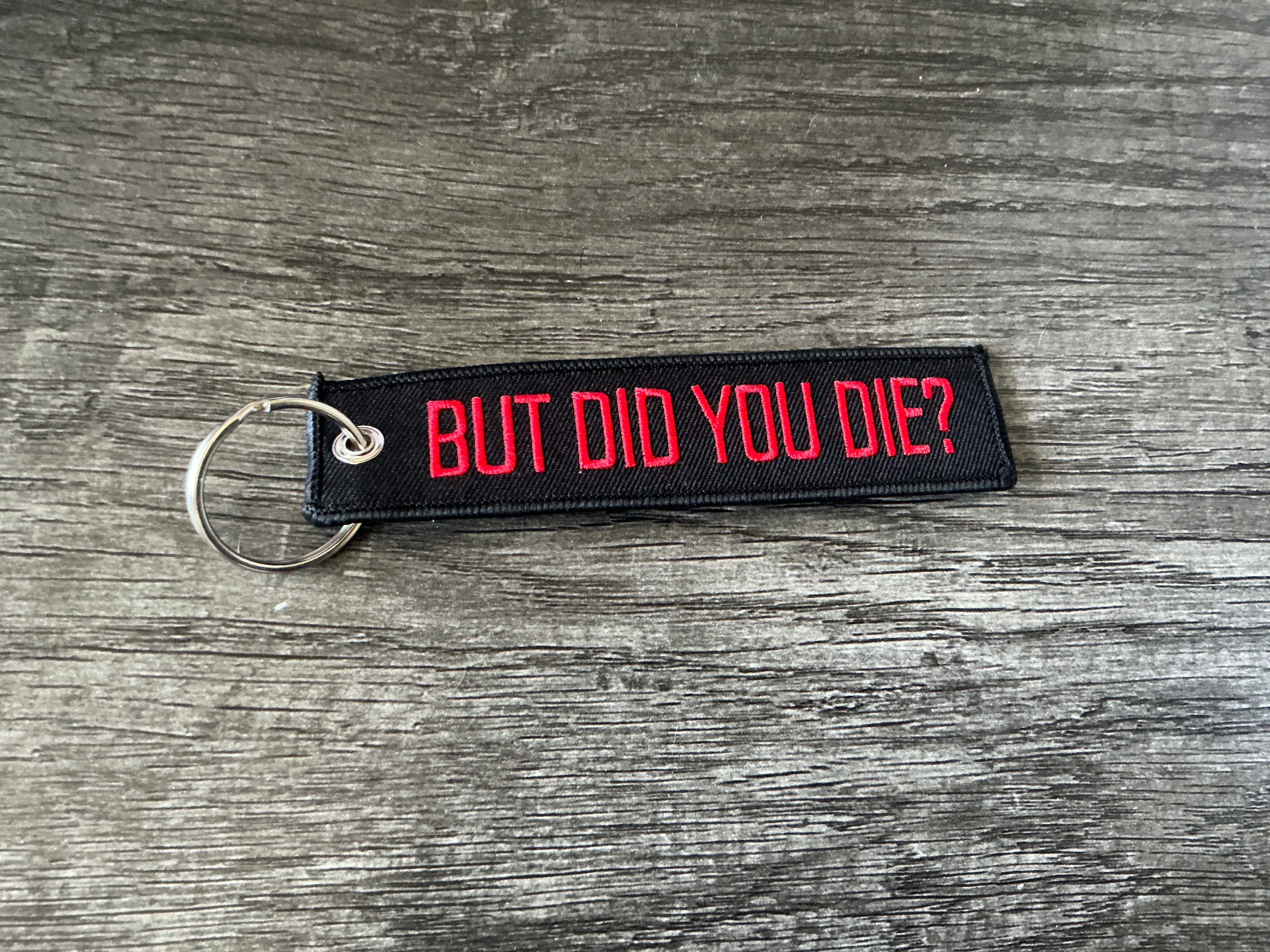 “But did you die” embroidered jet tag/keychain