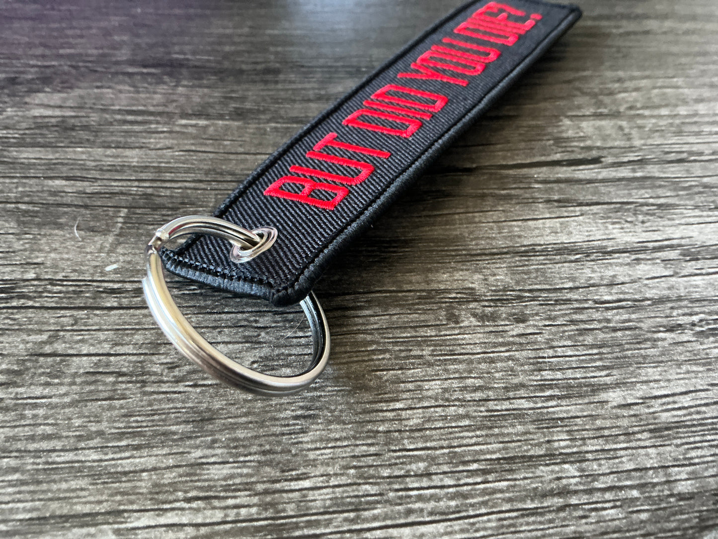 “But did you die” embroidered jet tag/keychain